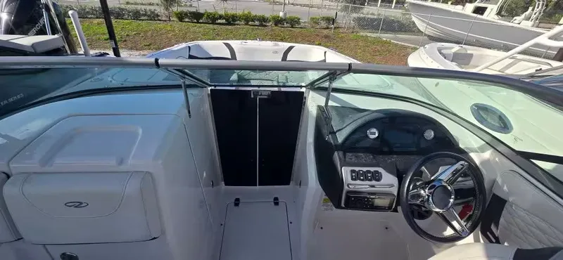 Slide: The Image of Interior view of a 2019 Regal 23 OBX boat with helm console. - 10