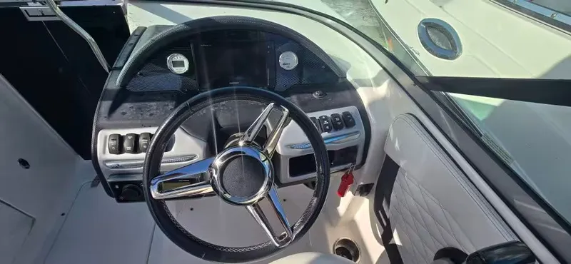 Slide: The Image of Interior view of a 2019 Regal 23 OBX boat helm. - 11