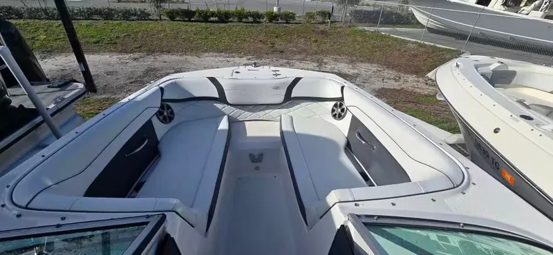 Slide: The Image of Interior view of a 2019 Regal 23 OBX boat with white upholstery. - 12