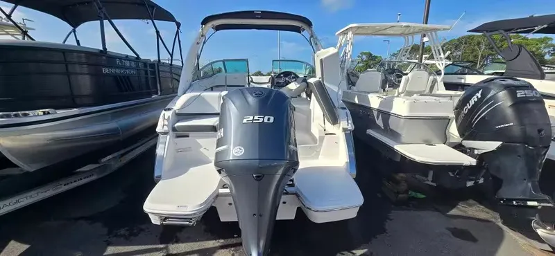 Slide: The Image of 2019 Regal 23 OBX boat with Yamaha 250 engine, parked in lot. - 2