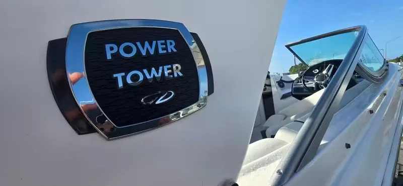 Slide: The Image of 2019 Regal 23 OBX boat with Power Tower emblem and cockpit view. - 3