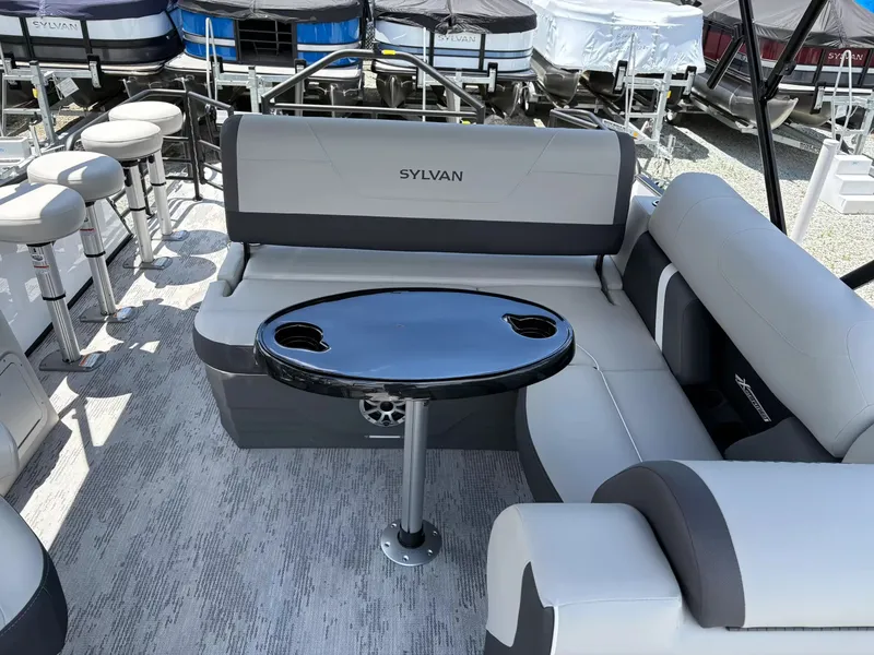 Slide: The Image of Interior of 2026 Sylvan X-3 DLZ BAR with gray seating and table. - 12