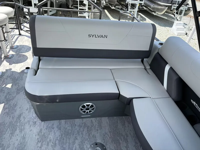 Slide: The Image of Sylvan X-3 DLZ BAR 2026 boat seating with gray upholstery. - 13