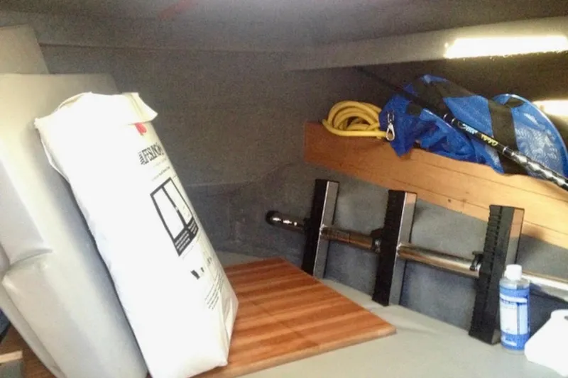 Slide: The Image of Interior storage of 2008 ACB 28 Explorer boat with equipment and supplies. - 14