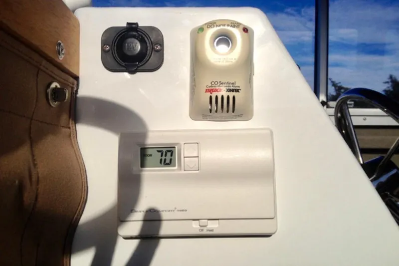 Slide: The Image of Control panel of a 2008 ACB 28 Explorer boat with CO detector and thermostat. - 19