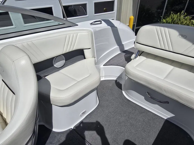 Slide: The Image of Interior of a 2006 Cobalt 232 boat with white leather seats. - 12