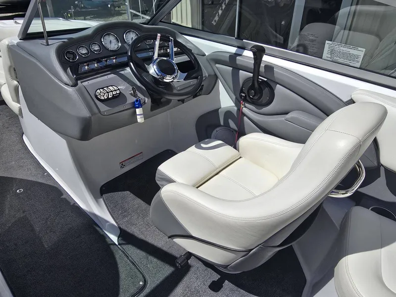 Slide: The Image of Interior of a 2006 Cobalt 232 boat with steering console. - 14