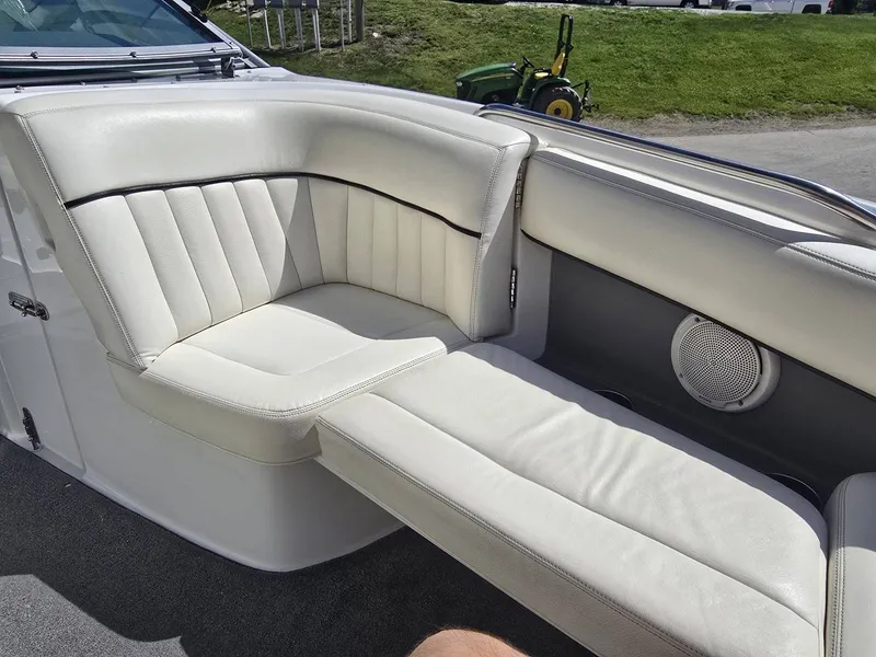 Slide: The Image of Interior of a 2006 Cobalt 232 boat with white leather seating. - 19