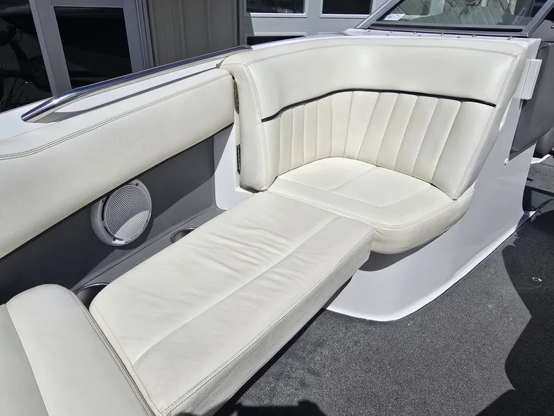 Slide: The Image of Interior of a 2006 Cobalt 232 boat with white leather seating. - 20