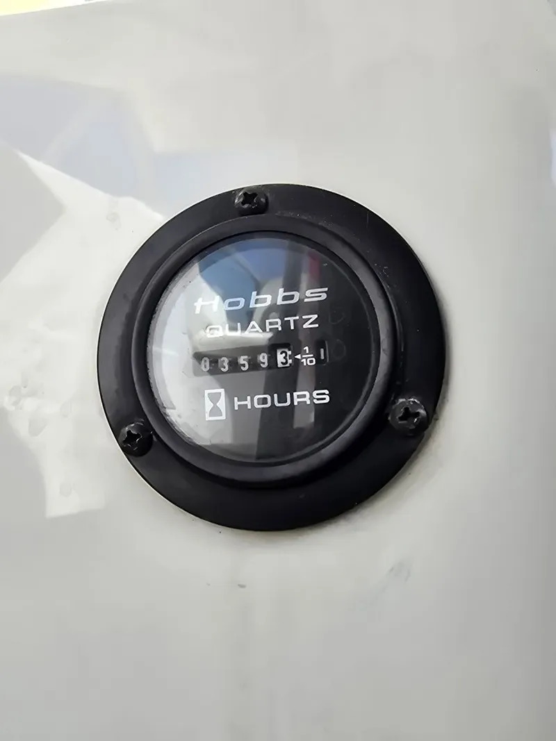 Slide: The Image of Hobbs Quartz hour meter on 2006 Cobalt 232 boat. - 24