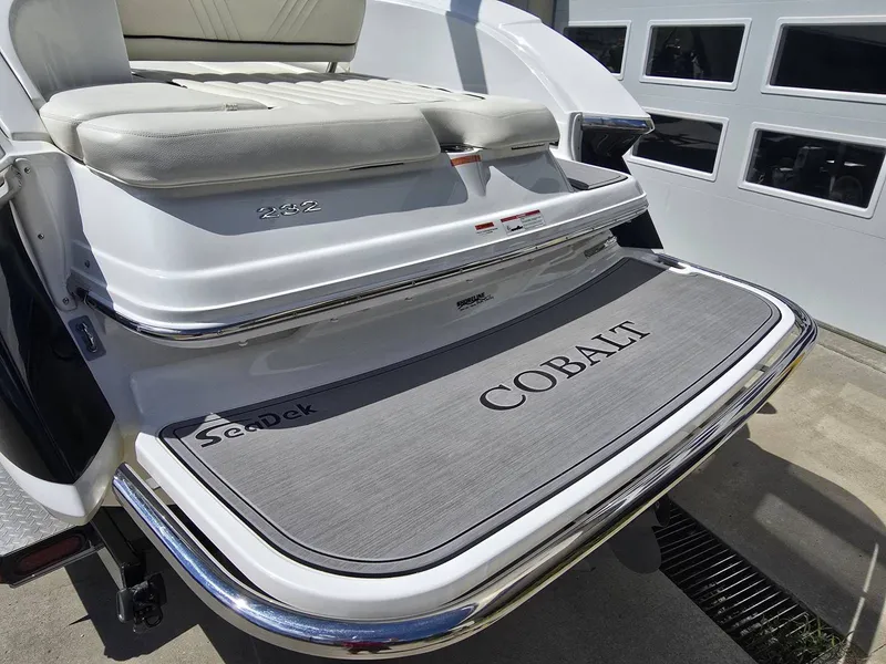 Slide: The Image of Rear view of a 2006 Cobalt 232 boat with SeaDek padding. - 4