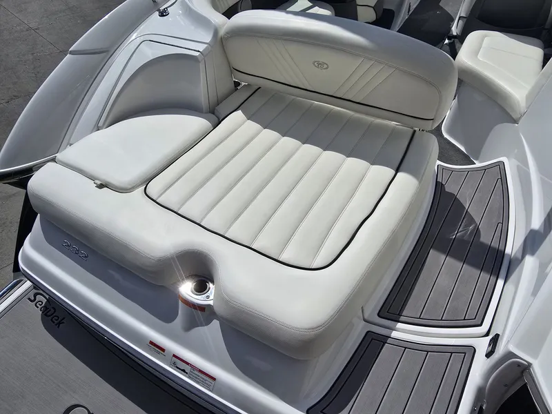 Slide: The Image of Rear view of a 2006 Cobalt 232 boat with cushioned seating area. - 8