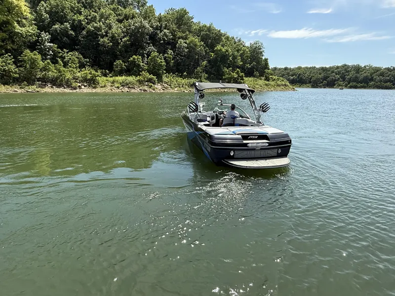 Slide: The Image of 2013 MB SPORTS B52 boat on a calm lake. - 11