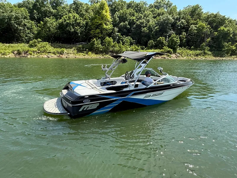 Slide: The Image of 2013 MB SPORTS B52 boat on a calm lake. - 21