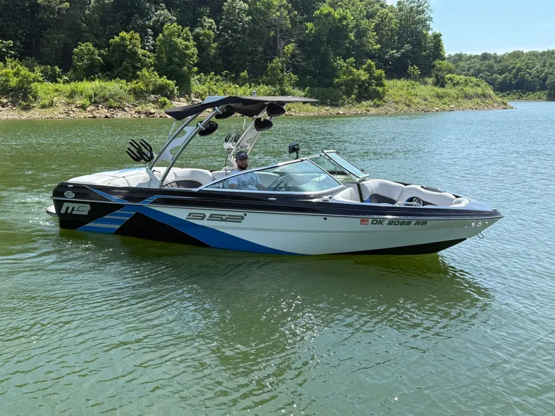 Slide: The Image of 2013 MB SPORTS B52 boat on a calm lake. - 22