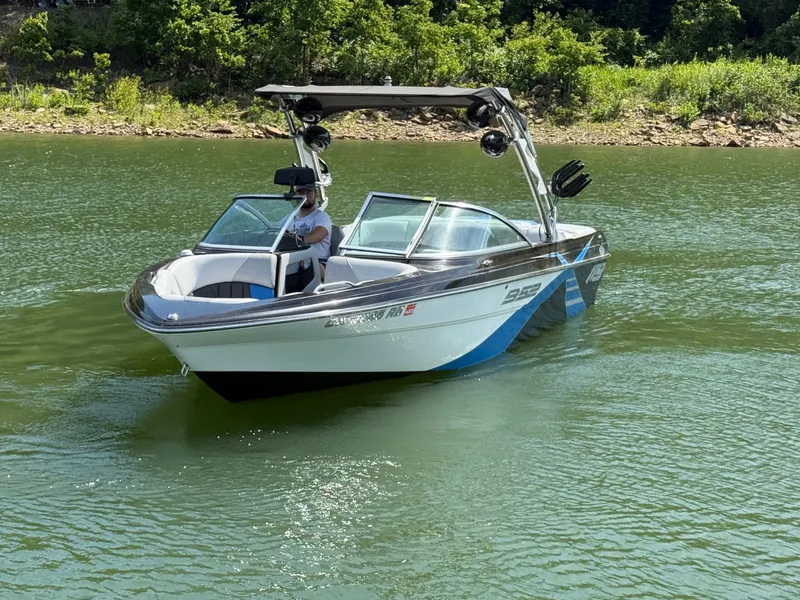 Slide: The Image of 2013 MB SPORTS B52 boat on a calm lake. - 23