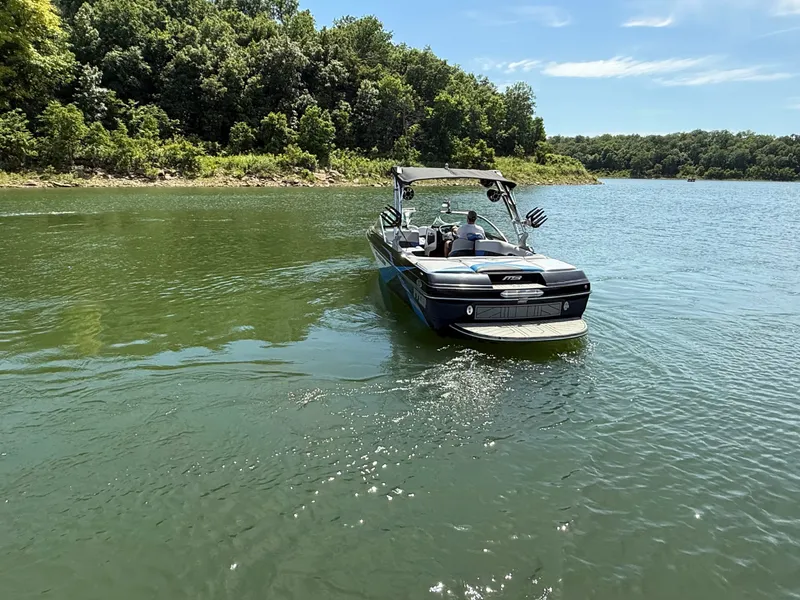 Slide: The Image of 2013 MB SPORTS B52 boat on a tranquil lake. - 24