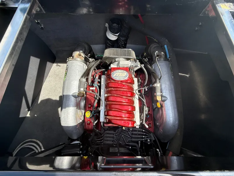Slide: The Image of Engine of a 2013 MB SPORTS B52 boat, close-up view. - 25