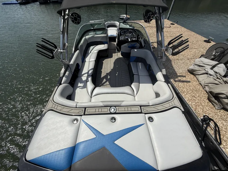 Slide: The Image of 2013 MB SPORTS B52 boat with spacious interior at the dock. - 3