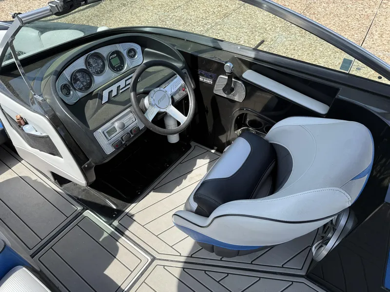 Slide: The Image of Interior of a 2013 MB SPORTS B52 boat with steering console. - 5