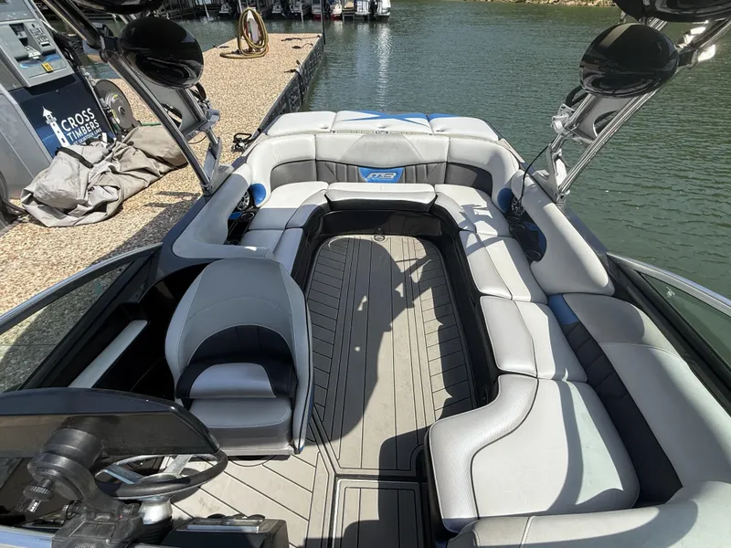 Slide: The Image of Interior of a 2013 MB SPORTS B52 boat by the water. - 7