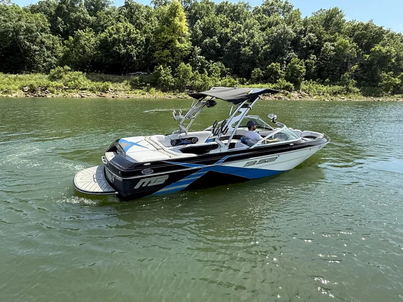 Slide: The Image of 2013 MB SPORTS B52 boat on a calm lake. - 9
