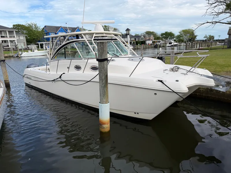 The Image of 2016 World Cat 320 EC boat docked in harbor. - 1
