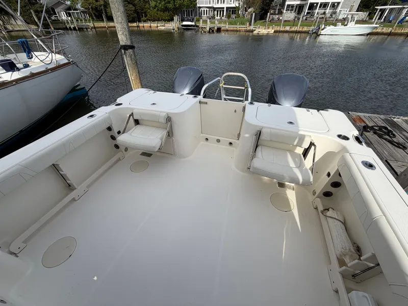Slide: The Image of 2016 World Cat 320 EC boat with spacious deck and seating. - 14