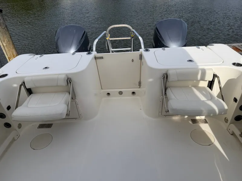 Slide: The Image of Rear view of a 2016 World Cat 320 EC boat with dual engines. - 15