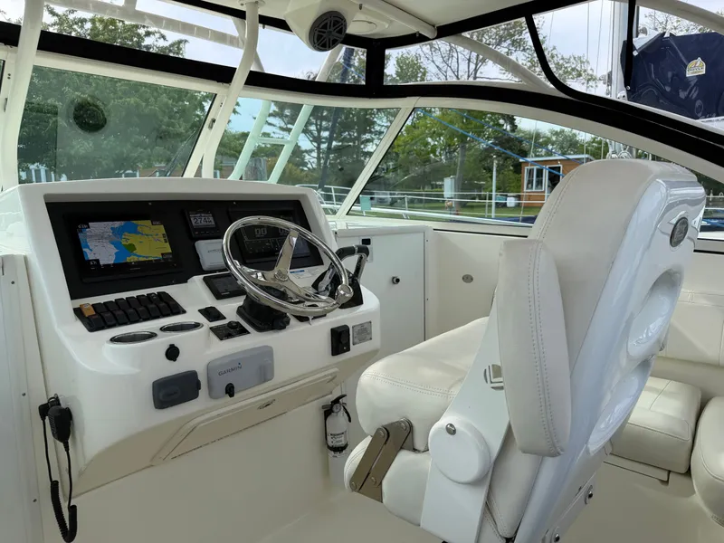 Slide: The Image of Interior view of a 2016 World Cat 320 EC boat helm. - 17