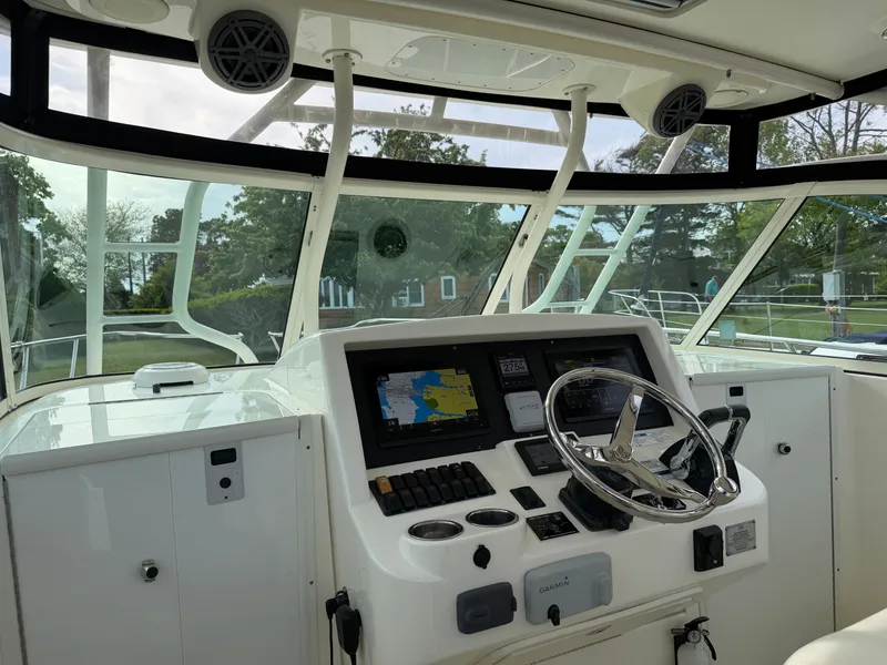 Slide: The Image of Interior view of 2016 World Cat 320 EC boat cockpit. - 20