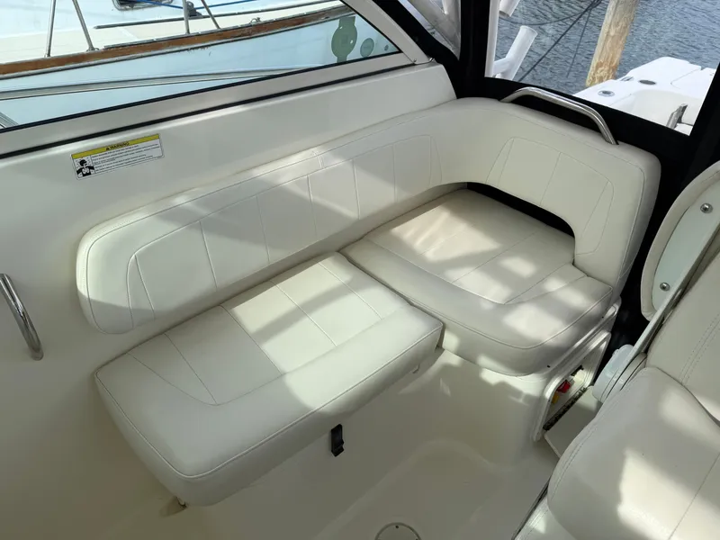 Slide: The Image of Interior of 2016 World Cat 320 EC with white leather seating. - 21