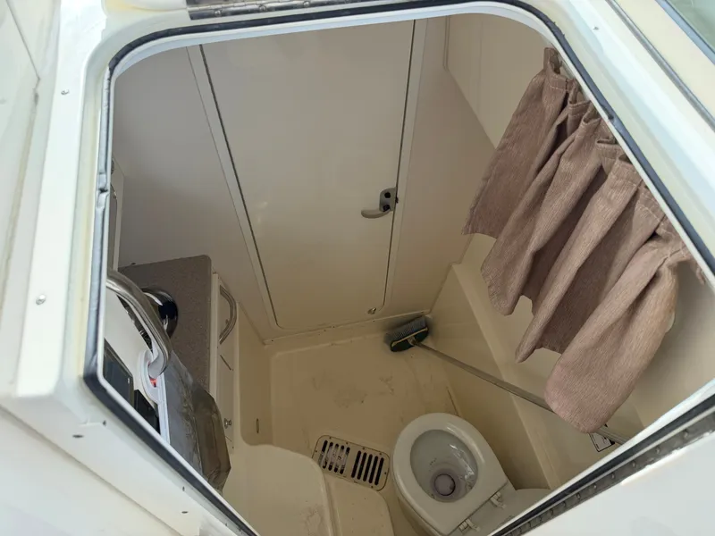 Slide: The Image of Interior of a 2016 World Cat 320 EC yacht with toilet. - 24