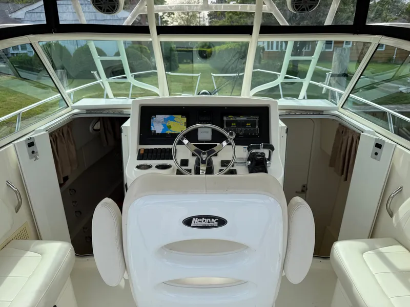 Slide: The Image of Interior view of 2016 World Cat 320 EC boat cockpit. - 25