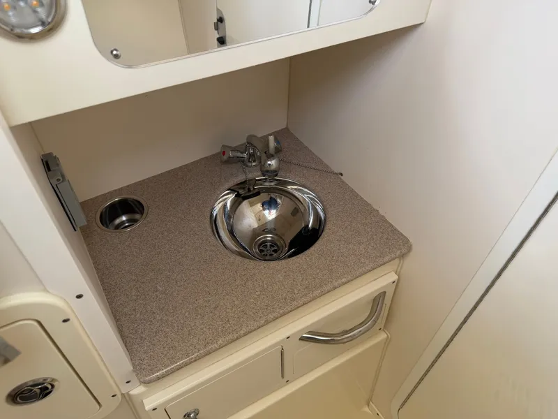 Slide: The Image of Compact sink in 2016 World Cat 320 EC boat. - 27