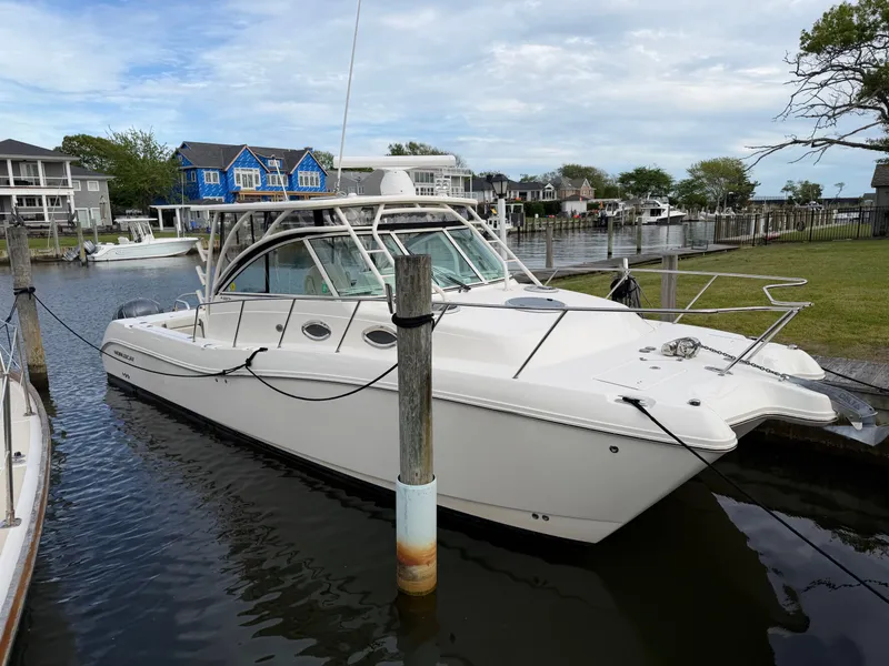 Slide: The Image of 2016 World Cat 320 EC boat docked in harbor. - 3