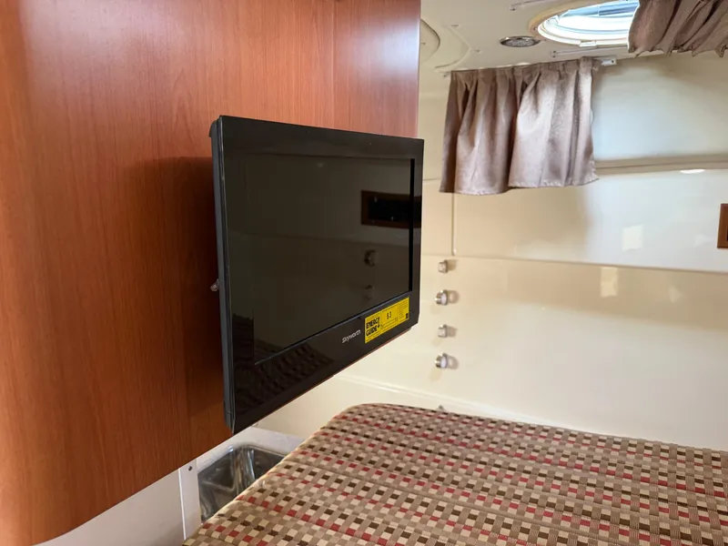 Slide: The Image of Interior of a 2016 World Cat 320 EC with TV and bed. - 31