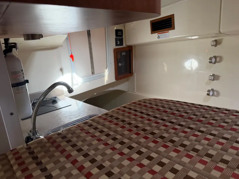 Slide: The Image of Interior of 2016 World Cat 320 EC with kitchen and seating area. - 34