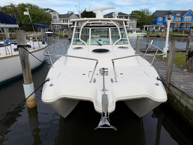 Slide: The Image of 2016 World Cat 320 EC boat docked in harbor. - 4