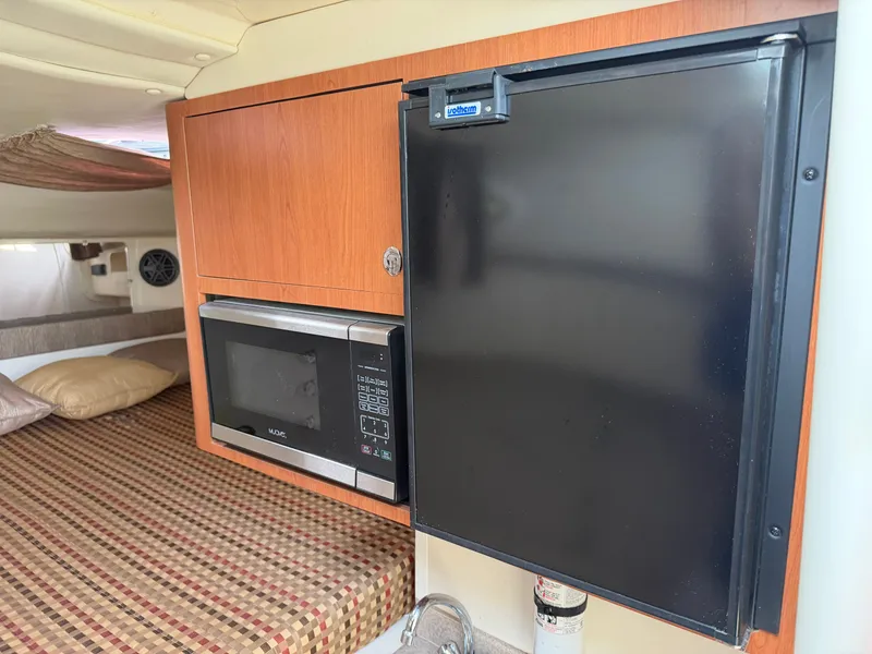 Slide: The Image of Interior of 2016 World Cat 320 EC with microwave and fridge. - 41