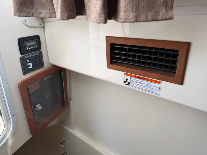 Slide: The Image of Interior of a 2016 World Cat 320 EC boat with vent grille. - 42