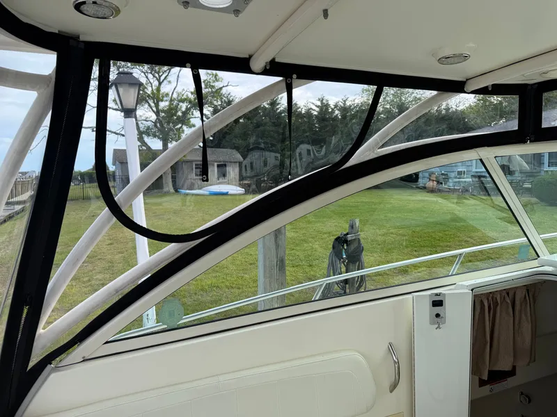 Slide: The Image of Interior view of a 2016 World Cat 320 EC yacht overlooking the lawn. - 43