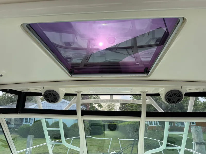 Slide: The Image of Interior view of 2016 World Cat 320 EC with purple skylight. - 44
