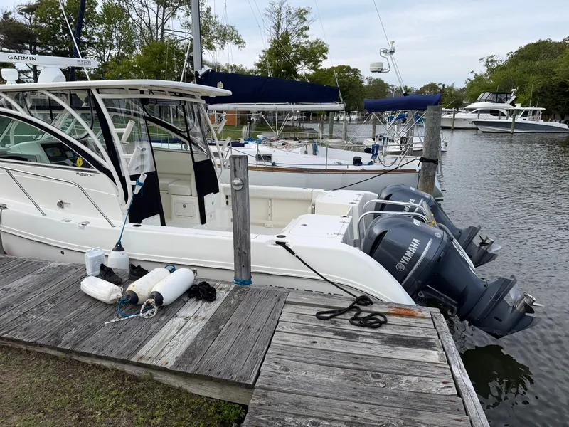 Slide: The Image of 2016 World Cat 320 EC boat docked with Yamaha engines. - 6