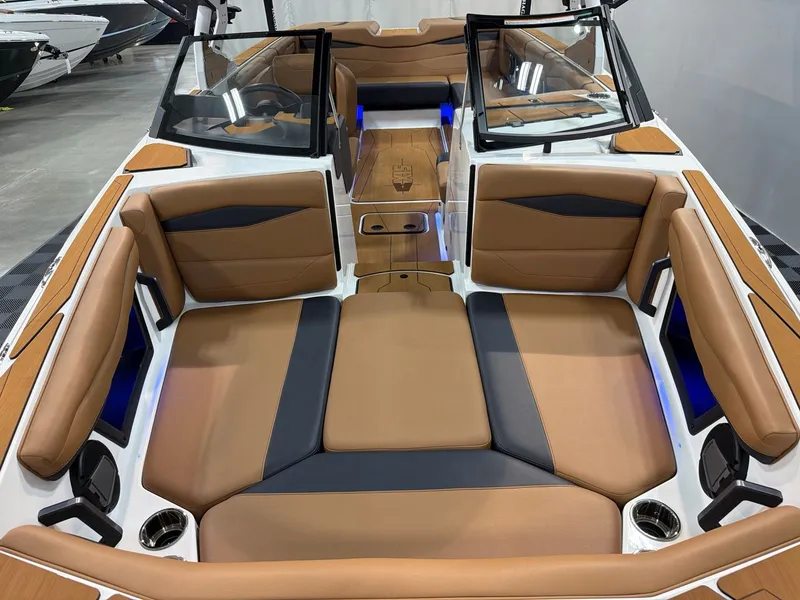 Slide: The Image of Interior of Axis A245 boat, 2026 model, featuring brown leather seats. - 11
