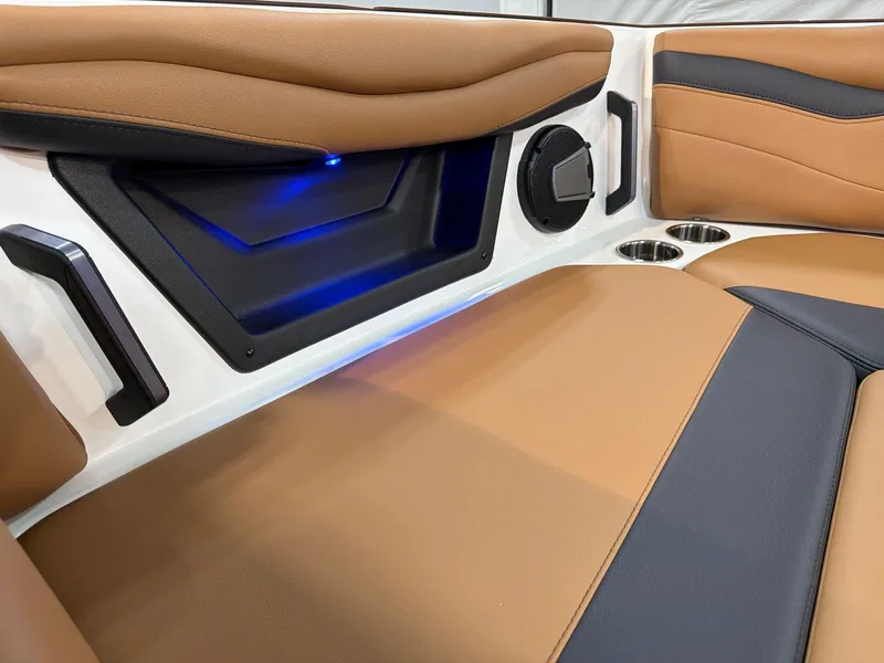 Slide: The Image of Interior of Axis A245 boat, brown and black upholstery, speaker, and LED lighting. - 12