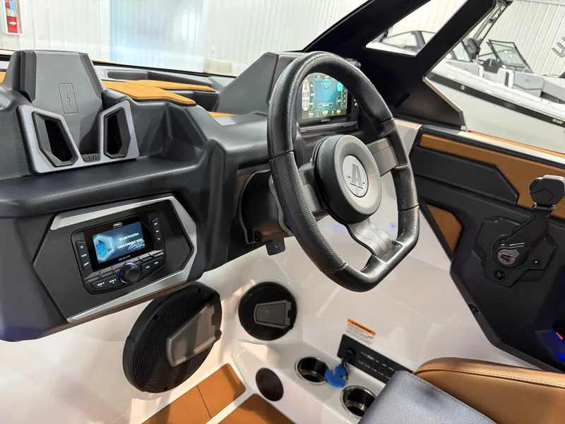 Slide: The Image of Interior of Axis A245 boat, 2026 model, featuring modern control console. - 19