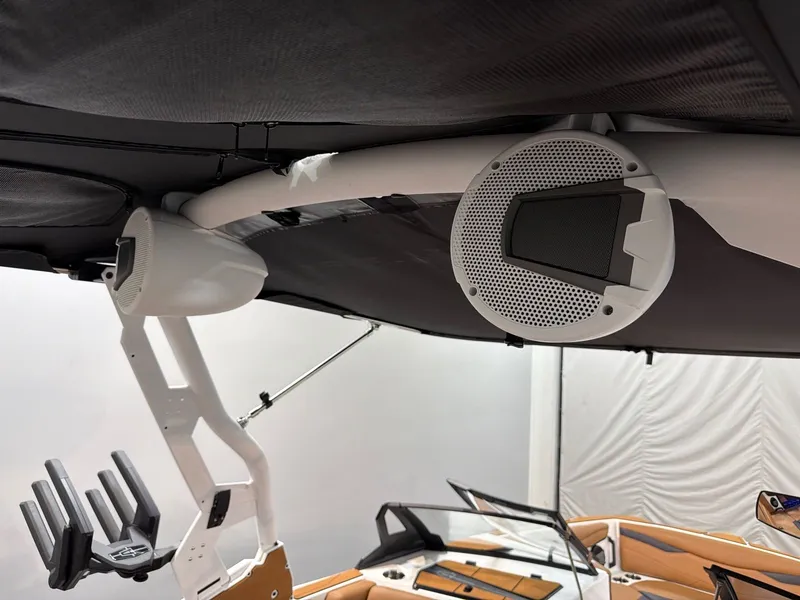Slide: The Image of Axis A245 2026 boat with speakers and canopy view. - 24