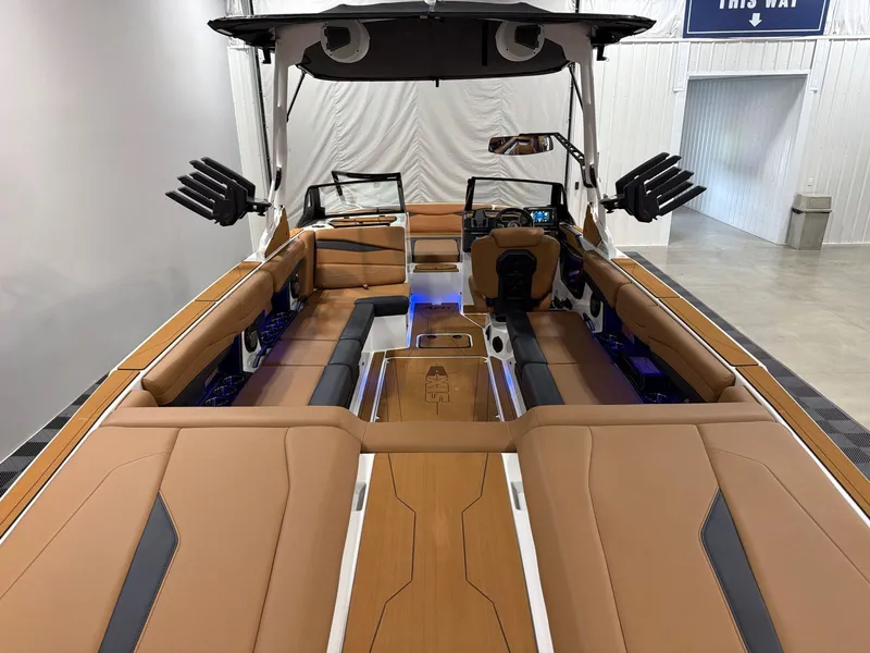 Slide: The Image of Interior of Axis A245 boat, 2026 model, featuring luxurious brown seating. - 6