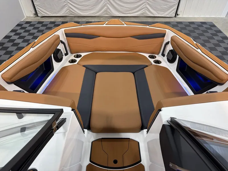 Slide: The Image of Interior of Axis A245 boat, luxurious brown upholstery, model year 2026. - 9